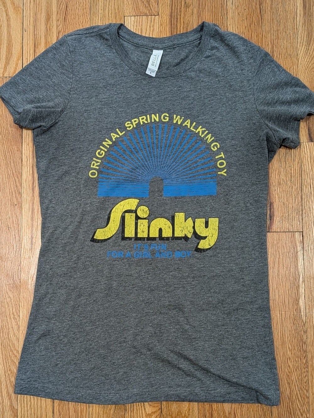 Slinky Graphic Tee - Gray with Yellow & Blue Logo